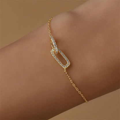 Model showcasing a 925 sterling silver bracelet with a zircon-studded link, adding a touch of sparkle to the wrist.