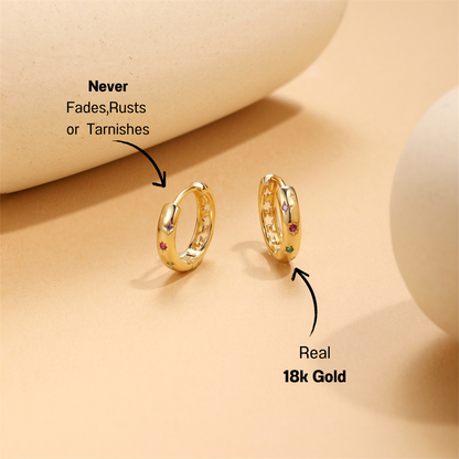 925 sterling silver colorful zirconia hoop earrings with green, red, and purple stones displayed on a soft neutral background