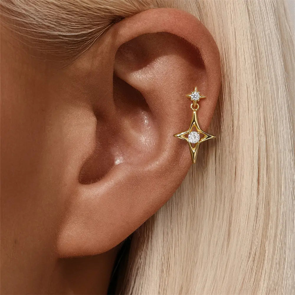 Model showcasing 925 sterling silver star drop earrings with zirconia accent, adding elegance to any outfit.