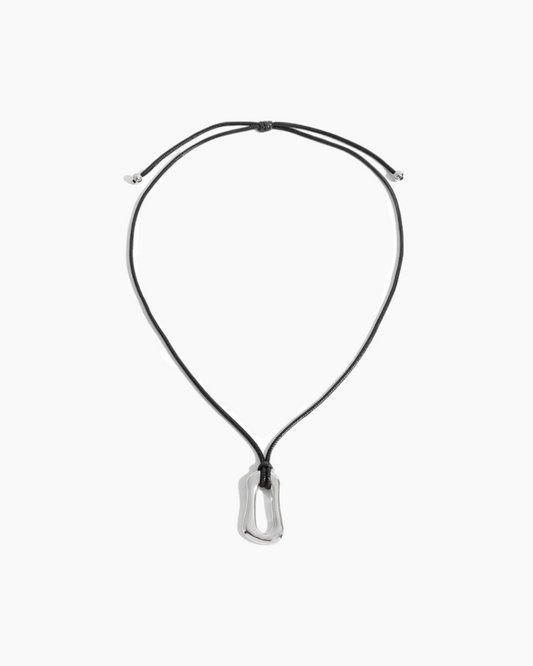 Black necklace with a silver pendant on a white background