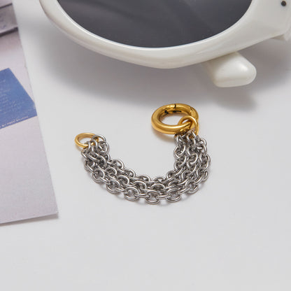Fashion ring with layered chains and golden ring center
