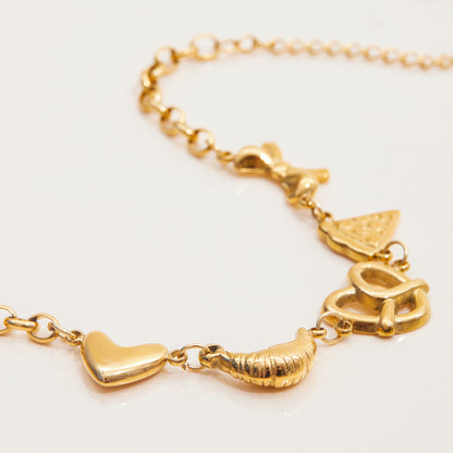 Gold bracelet with adjustable chain and quirky food pendants