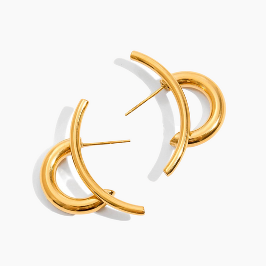 Gold hoop earrings on a white background