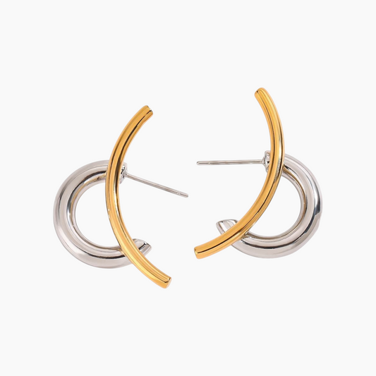 Pair of gold and silver hoop earrings on a white background