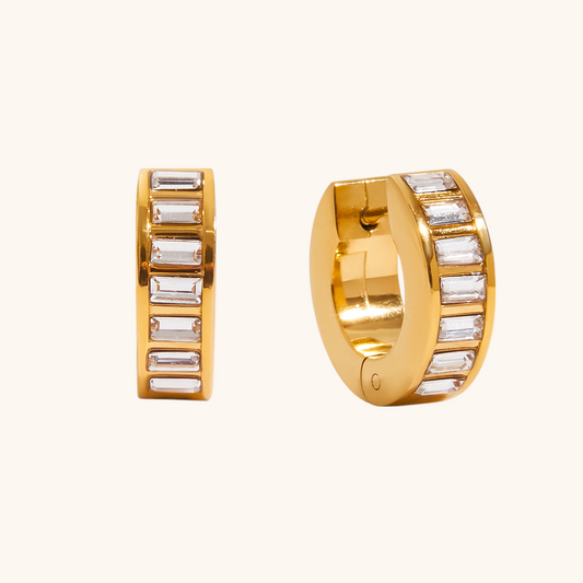 Gold baguette zircon hoop earrings on white background