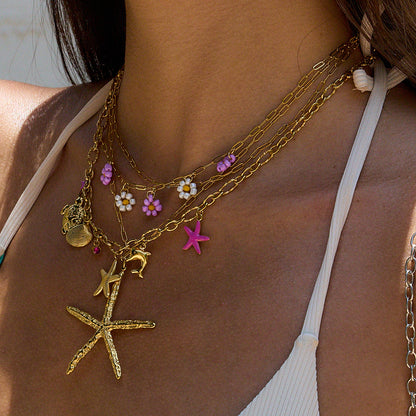 Resort-ready necklace styled on model in white swimsuit
