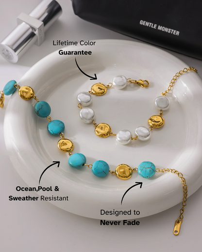 Necklace with blue and gold beads on a white dish, with text highlighting features.