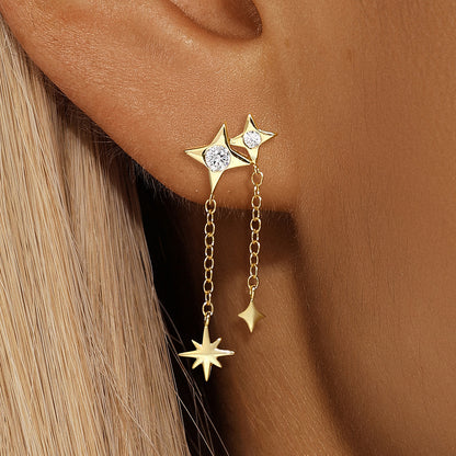 Gold floral ear climbers with rhinestone details, styled on model with blonde hair.
