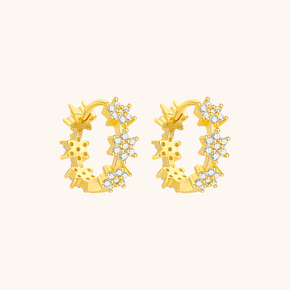 Detailed product view of gold vermeil daisy hoops with sparkling accents