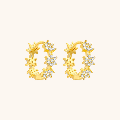 Detailed product view of gold vermeil daisy hoops with sparkling accents