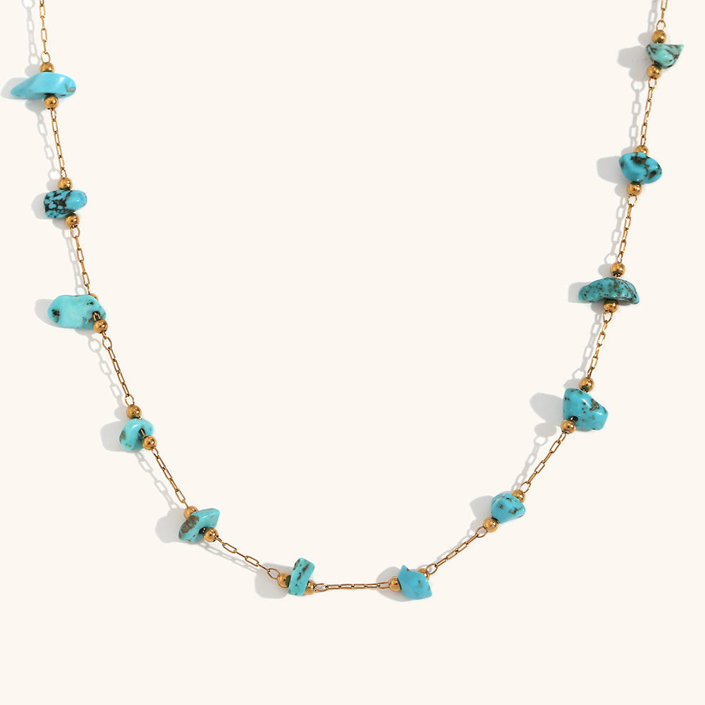 Turquoise necklace elegantly displayed on white background