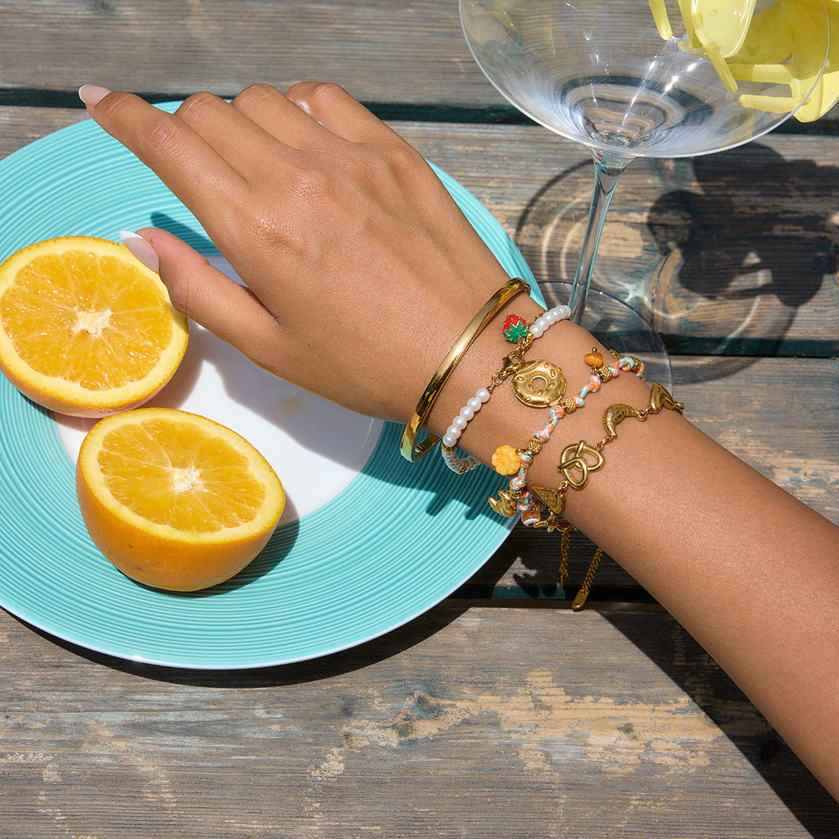 Summer beaded bracelet stack with gold bangles and pearls