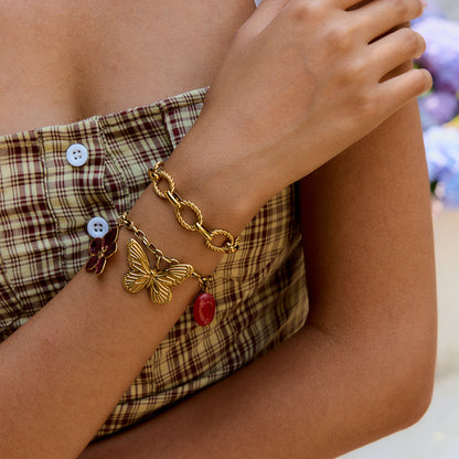 Bracelet styled with plaid dress, layered with twisted gold bangle