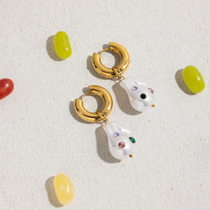 Summer flat lay of pearl charm earrings with colorful beads