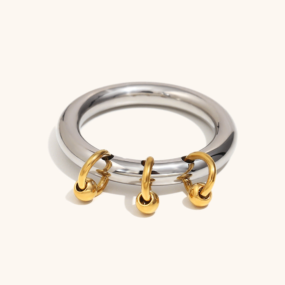 Shiny dome-shaped ring with gold loops, water-resistant and guaranteed never to fade