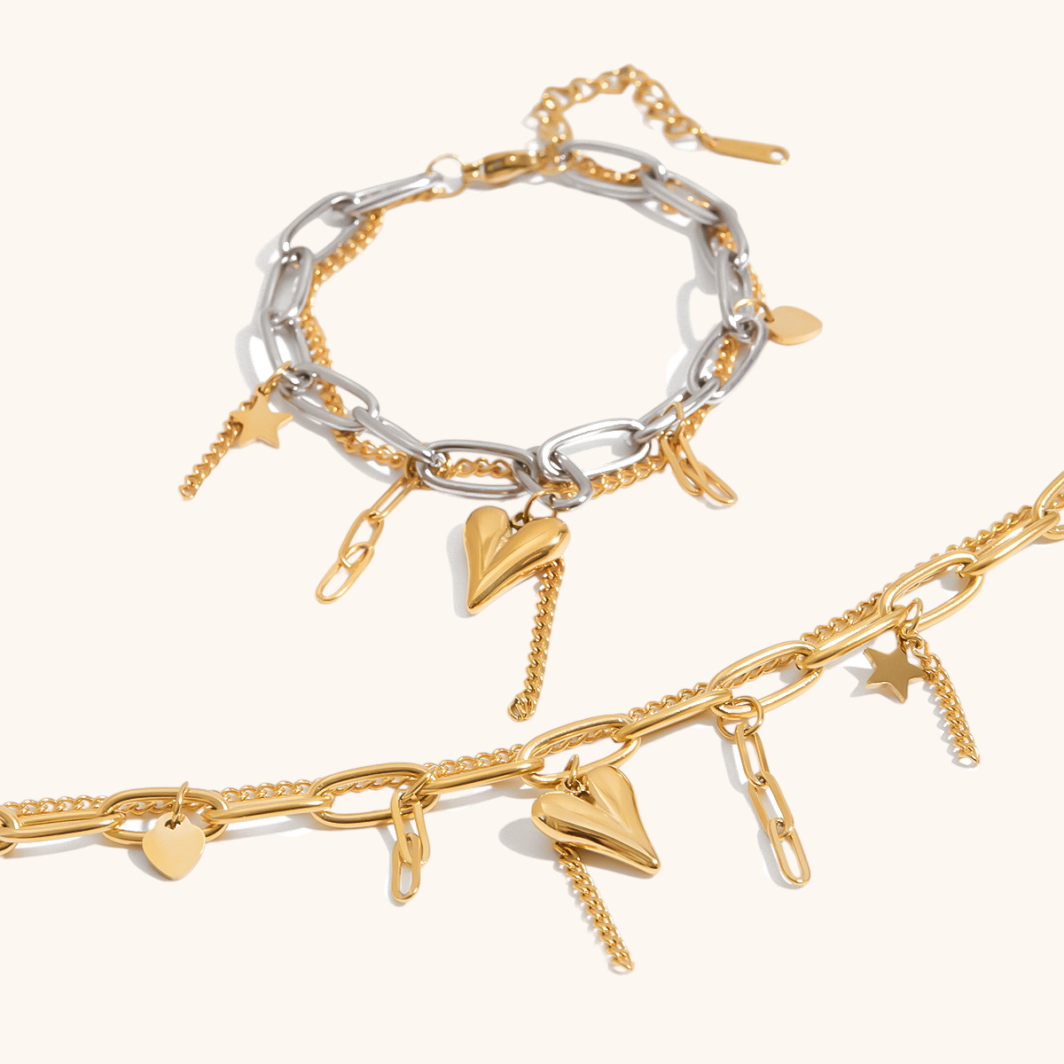 Golden and mixed-metal bracelets styled side-by-side with charms