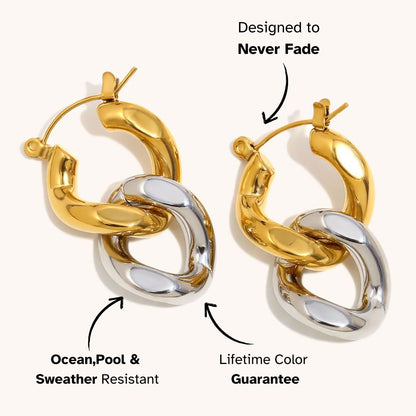 Chunky mixed-metal hoop earrings in gold and silver, styled for statement looks in edgy London streetwear.