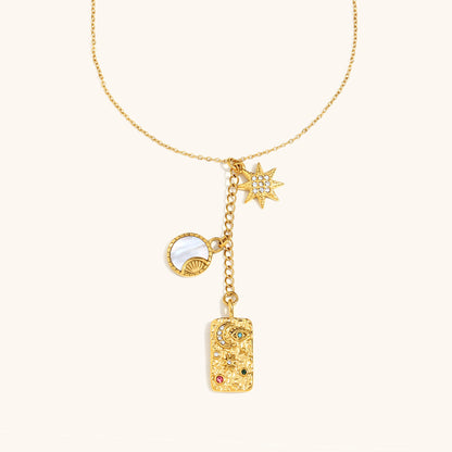 Dainty gold necklace with moon and star charms for celestial style lovers
