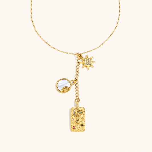 Dainty gold necklace with moon and star charms for celestial style lovers