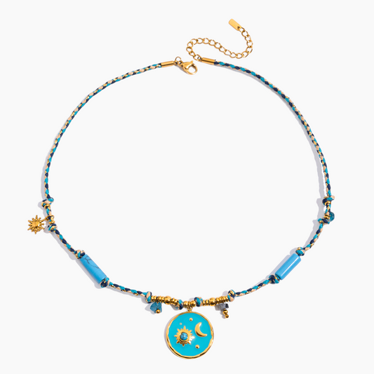 Necklace with blue and gold beads on a white background