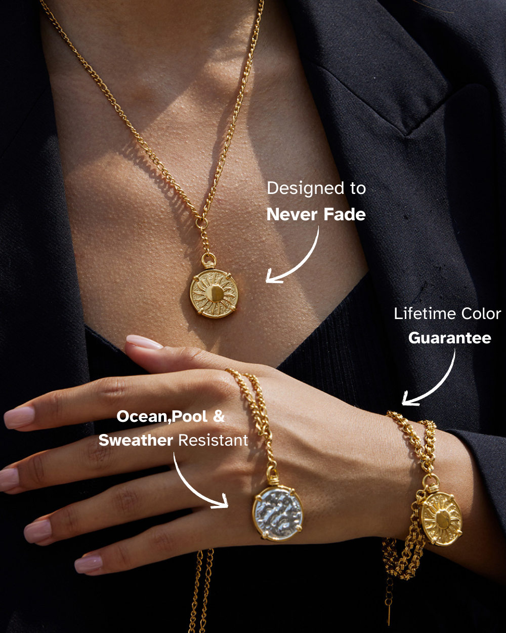 Gold necklaces with pendants on a person wearing a black outfit.