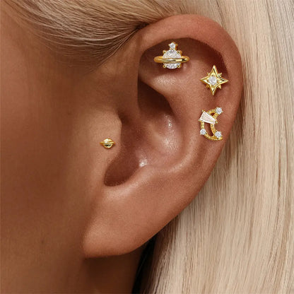 Model showcasing celestial zirconia star and planet stud earrings in 925 sterling silver, highlighting delicate design.