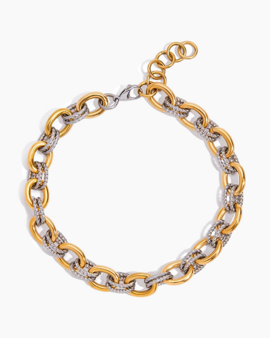 Gold and silver chain bracelet on a white background