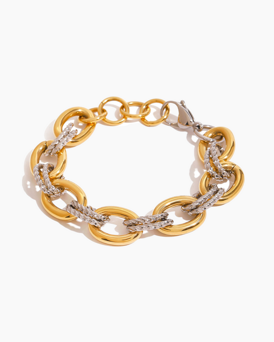 Gold and silver chain bracelet on a white background