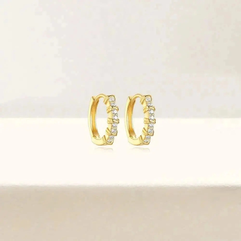 Classic Gold Huggie with Diamond Studs – Timeless and versatile, these gold huggie earrings are accented with diamond studs for an understated yet glamorous look.