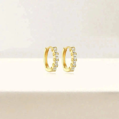 Classic Gold Huggie with Diamond Studs – Timeless and versatile, these gold huggie earrings are accented with diamond studs for an understated yet glamorous look.