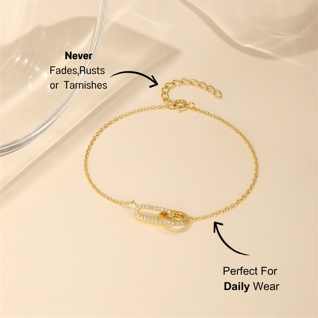 Close-up view of a 925 sterling silver bracelet, showcasing a zircon-studded link and fine chain design.