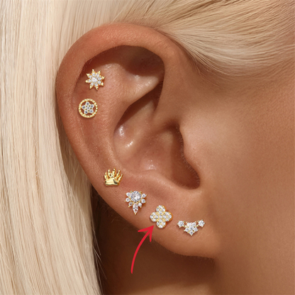 Close-up of 925 sterling silver four-leaf clover stud earrings with cubic zirconia for a sparkling, elegant style.