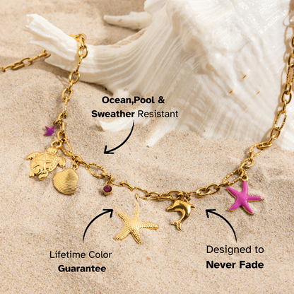 Sea-themed pendant necklace with tropical charms on sand