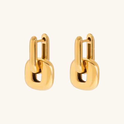 Collection of four gold and silver chunky earrings hanging outdoors, labeled waterproof and fadeproof.