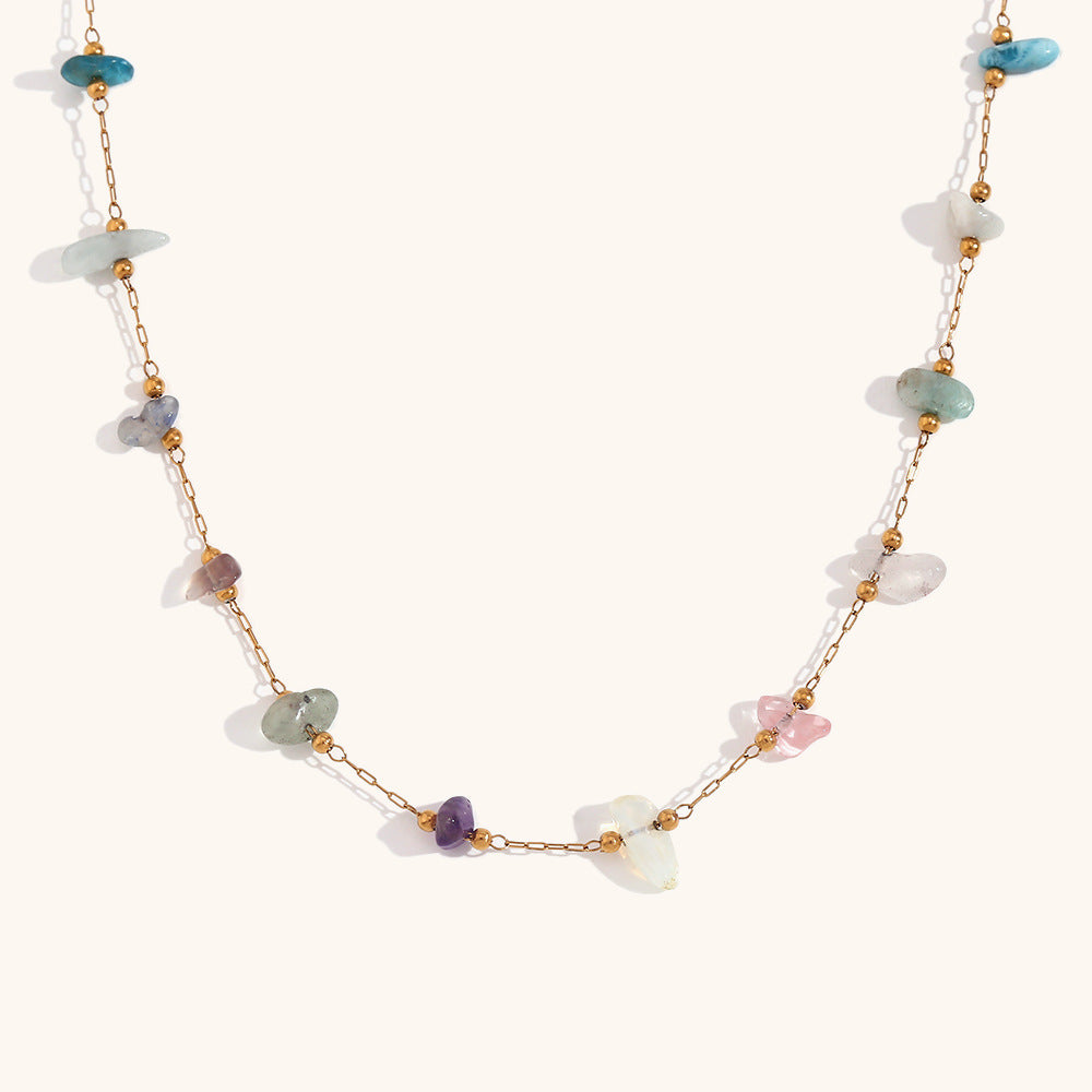 Flat lay of multi-stone necklace highlighting opal, quartz, and turquoise chips