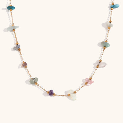 Flat lay of multi-stone necklace highlighting opal, quartz, and turquoise chips