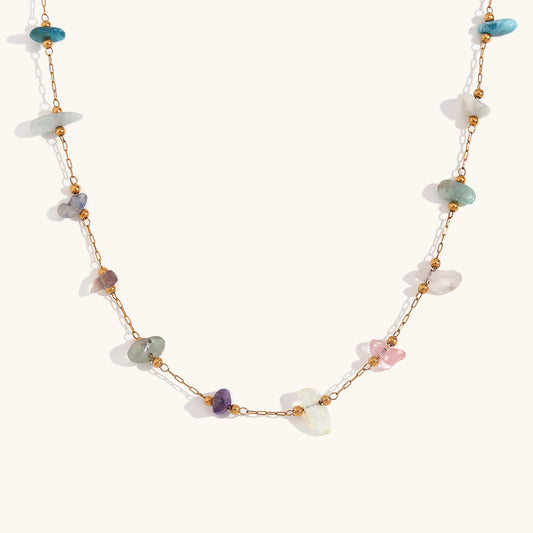 Flat lay of multi-stone necklace highlighting opal, quartz, and turquoise chips