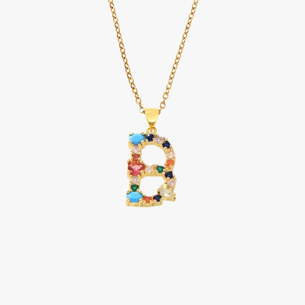 Golden pendant featuring the letter B, with vibrant red, green, and blue zircon stones on a gold chain.