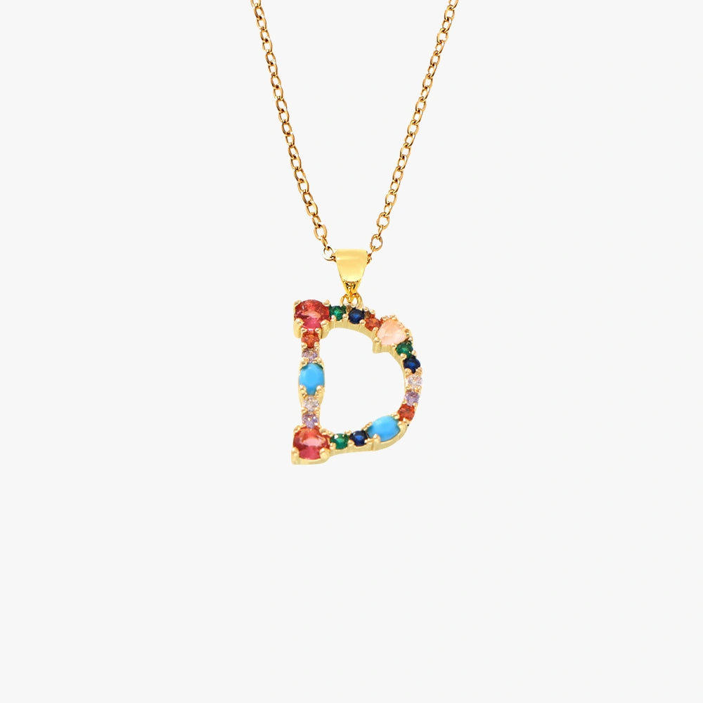 Golden pendant featuring the letter D, decorated with sparkling zircon stones in a colorful mix of red, blue, and green.