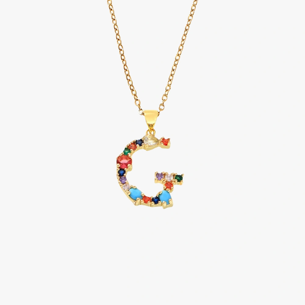  Letter G pendant in gold adorned with colorful zircon stones in a mix of hues, suspended from a gold chain.