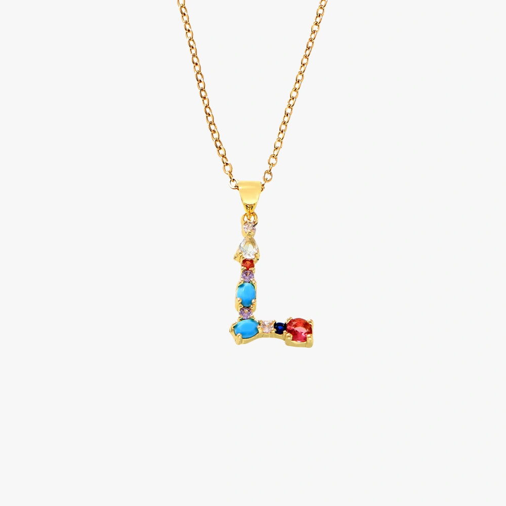 Golden letter L pendant with a mix of colorful zircon stones in red, blue, and yellow, hanging from a delicate gold chain.