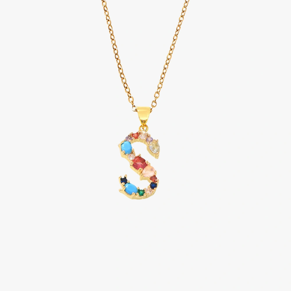 Gold letter S pendant featuring colorful zircon stones in a mix of hues, on a gold chain.