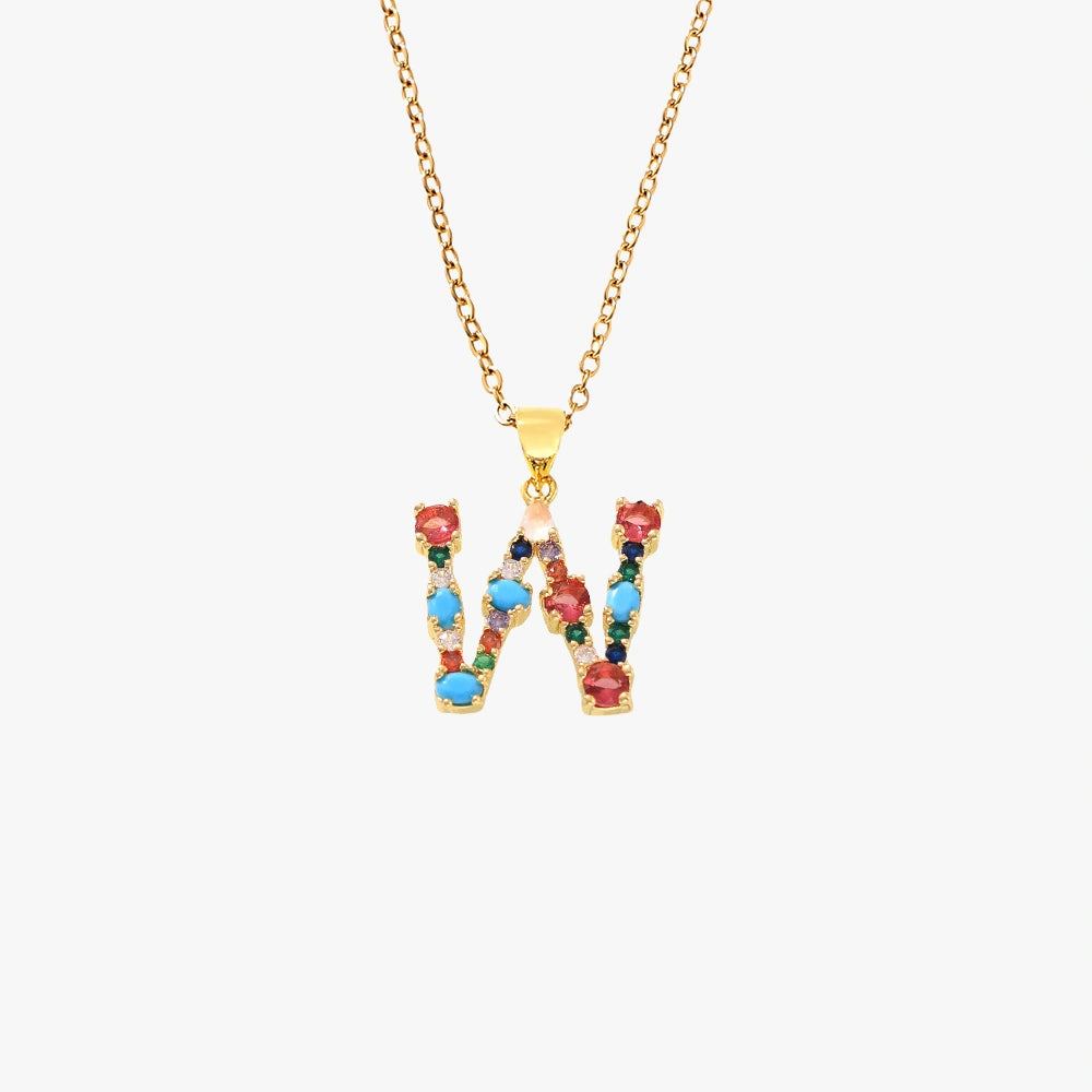 Golden letter W pendant with colorful zircon stones in various hues, hanging on a delicate gold chain.