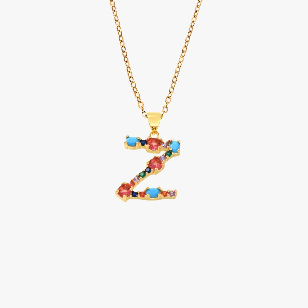 Gold letter Z pendant featuring colorful zircon stones in red, blue, and green, on a delicate chain.