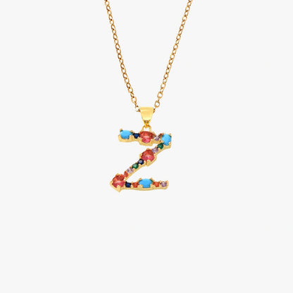 Gold letter Z pendant featuring colorful zircon stones in red, blue, and green, on a delicate chain.