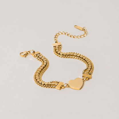 gold heart bracelet shown flat with extension clasp and sparkle