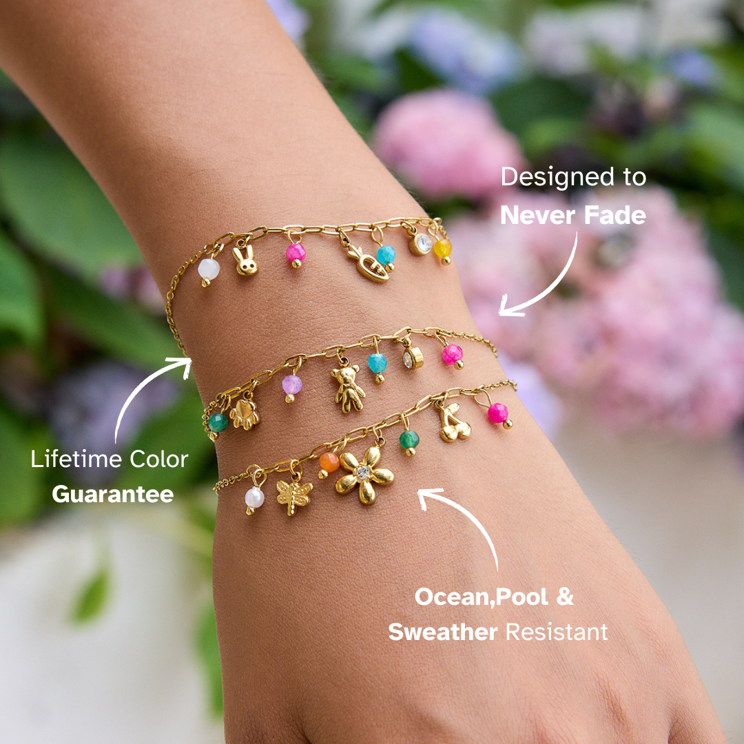 Gold bracelet with bunny, carrot, smiley face and bright beads