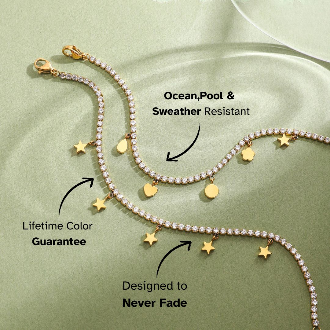 Flat lay of gold tennis bracelets with dangling celestial charms