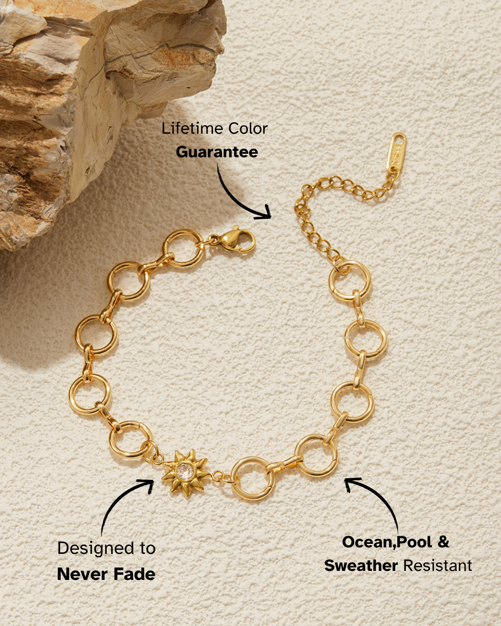Gold bracelet with features highlighted on a beige background
