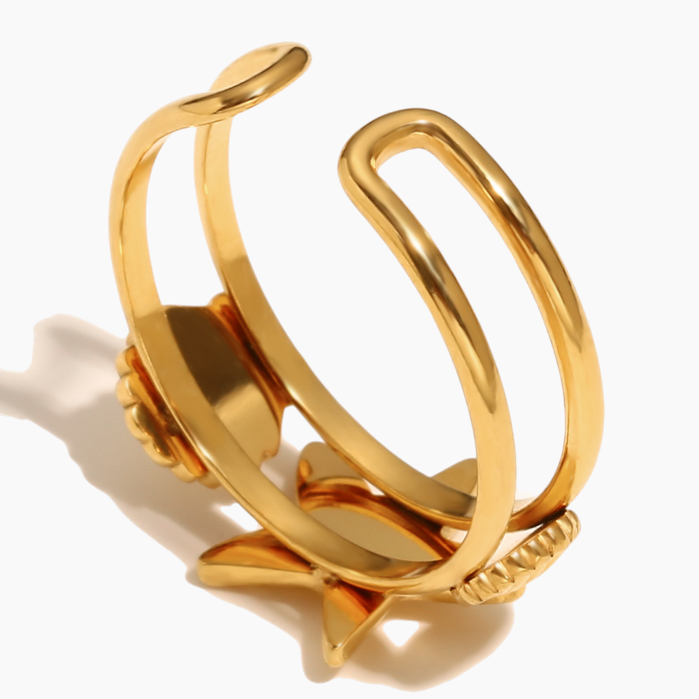 Elegant hand styling with gold starfish cocktail ring